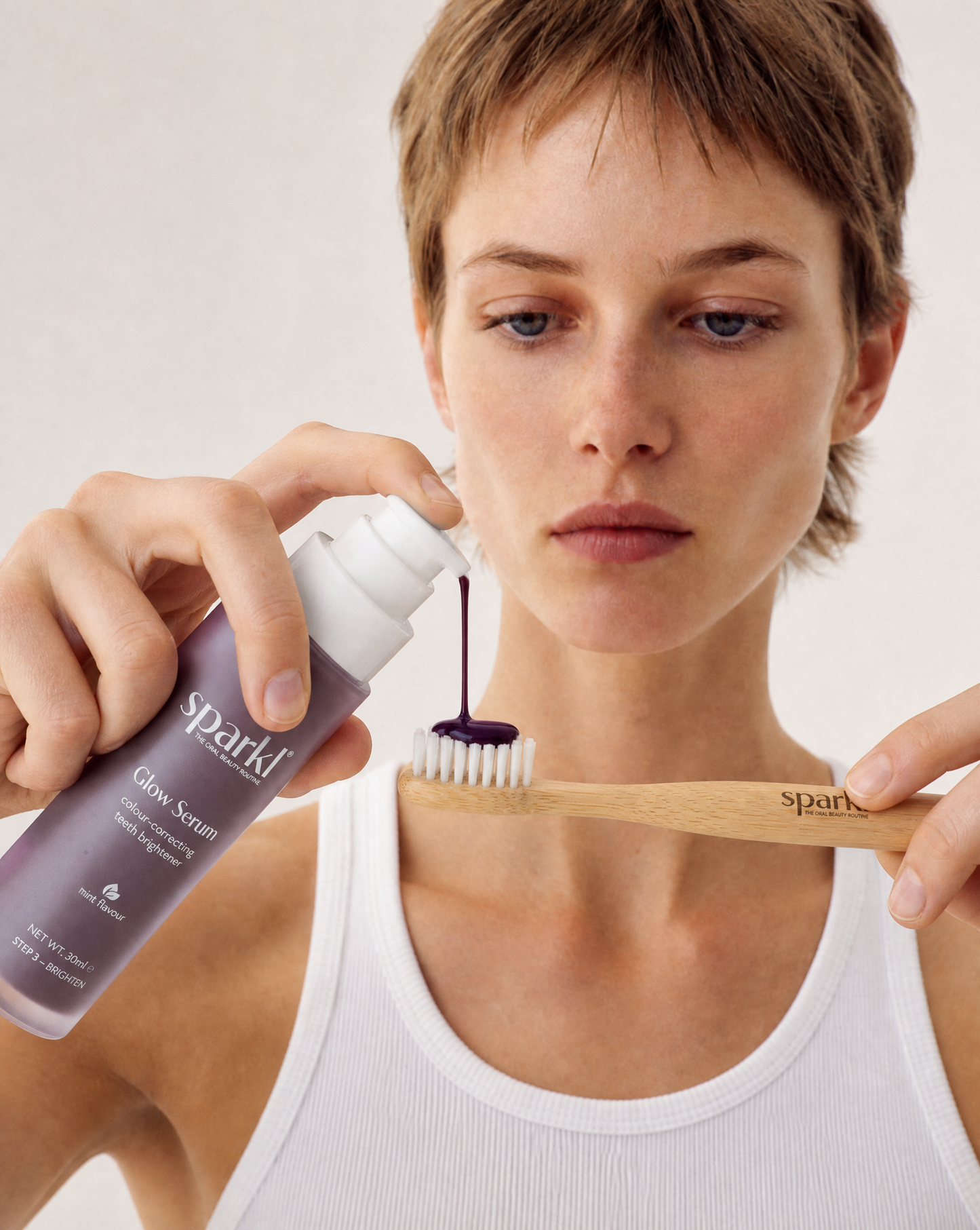 Model 2 pouring serum on brush