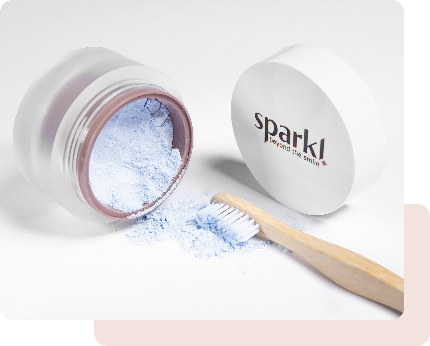 Wet your toothbrush with water and dip it  lightly into the powder